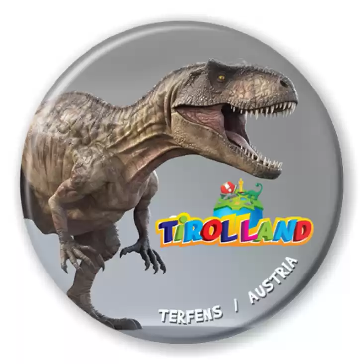 przypinka Tirolland Tyranozaur na szarym tle
