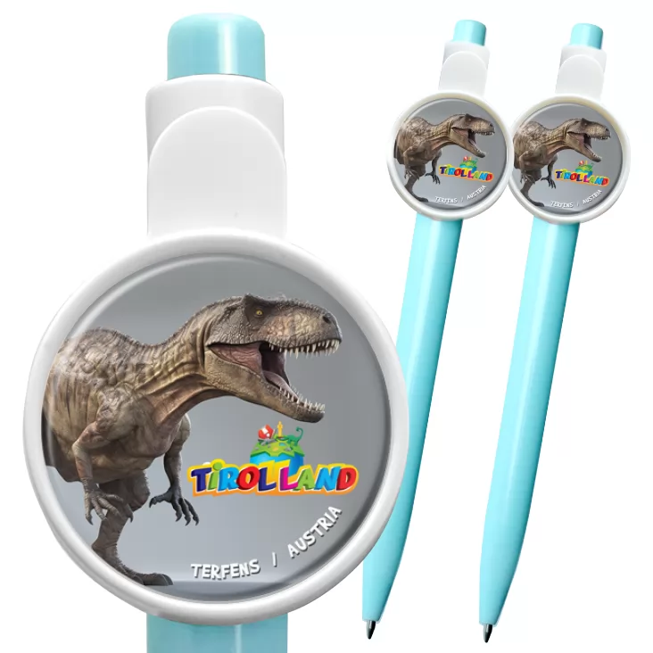 przypinka długopis Tirolland Tyranozaur na szarym tle