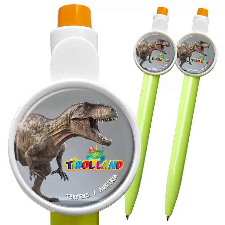 przypinka długopis Tirolland Tyranozaur na szarym tle