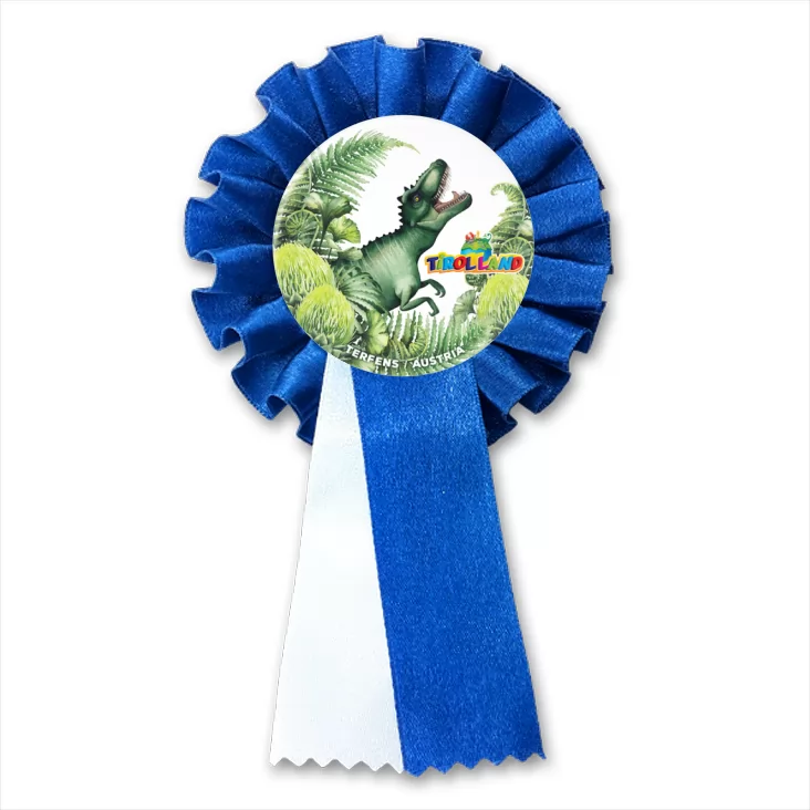 przypinka kotylion Tyranozaur wśród roślin Tirolland