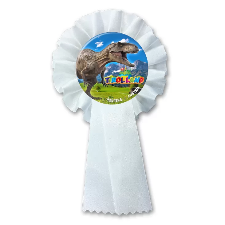 przypinka kotylion Tirolland Tyranozaur na tle gór