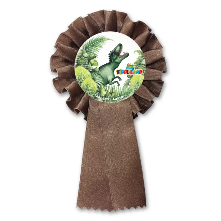 przypinka kotylion Tyranozaur wśród roślin Tirolland