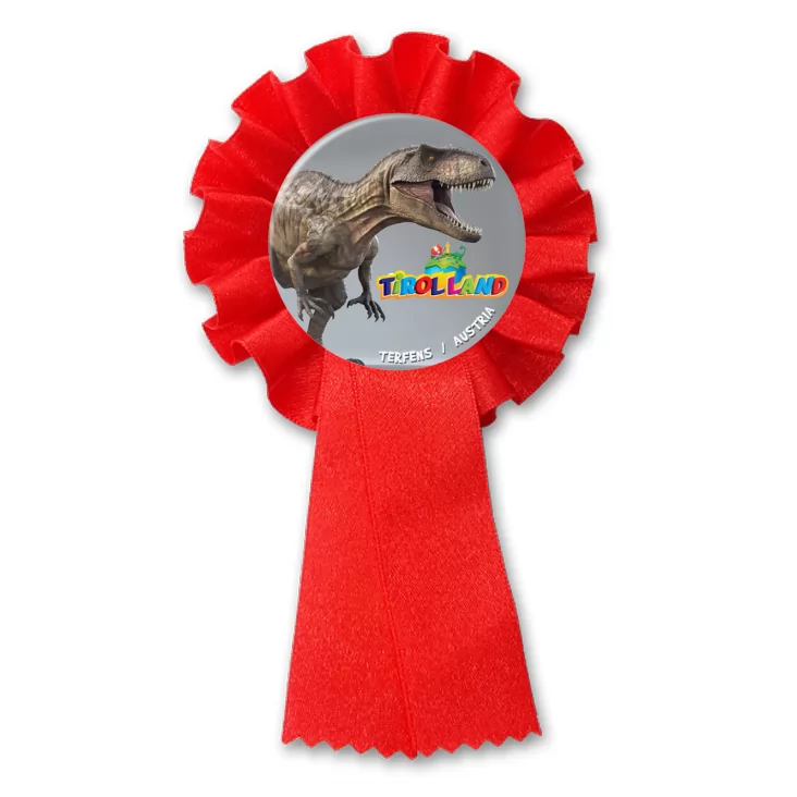 przypinka kotylion Tirolland Tyranozaur na szarym tle
