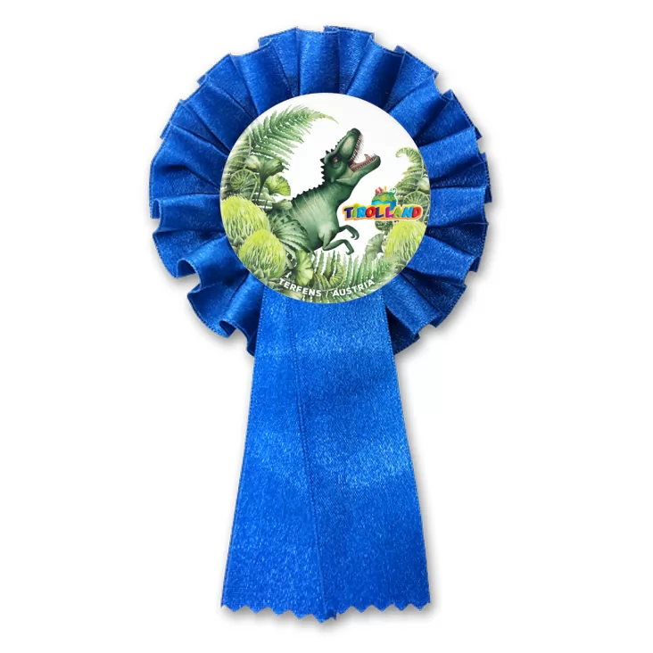 przypinka kotylion Tyranozaur wśród roślin Tirolland