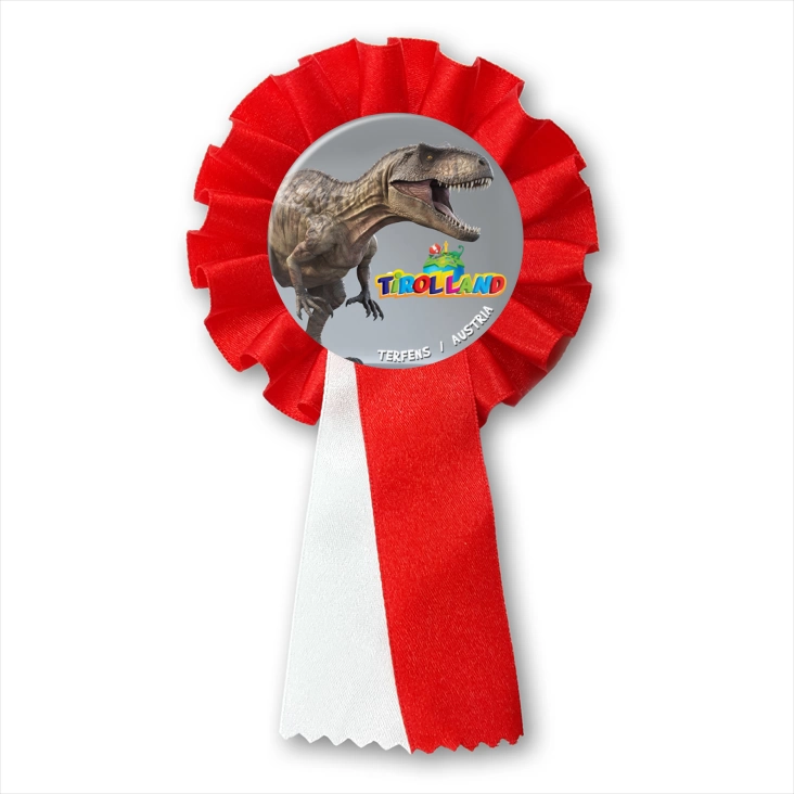 przypinka kotylion Tirolland Tyranozaur na szarym tle