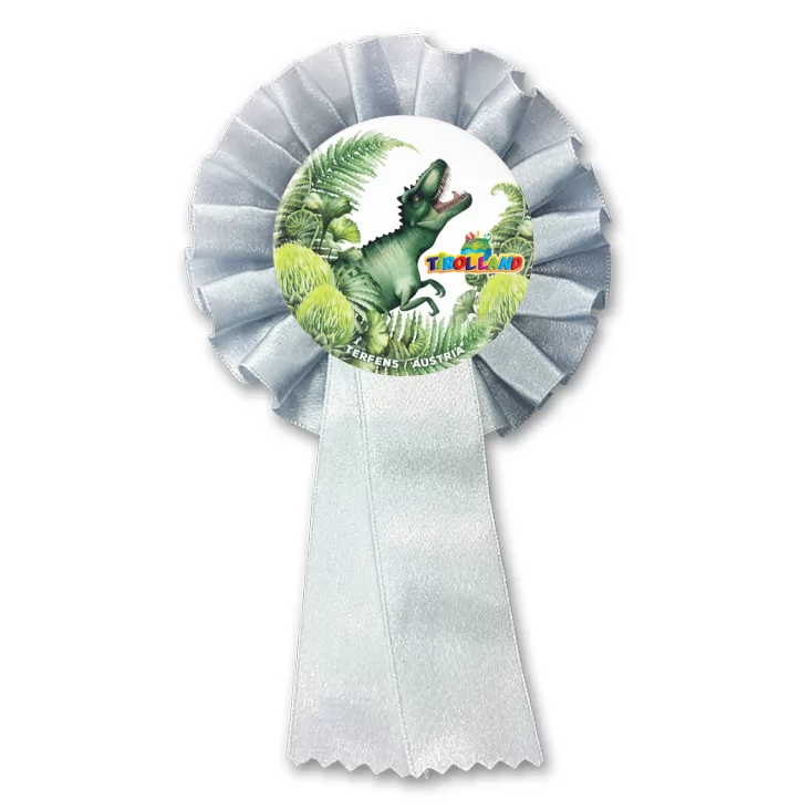 przypinka kotylion Tyranozaur wśród roślin Tirolland