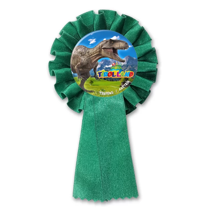 przypinka kotylion Tirolland Tyranozaur na tle gór