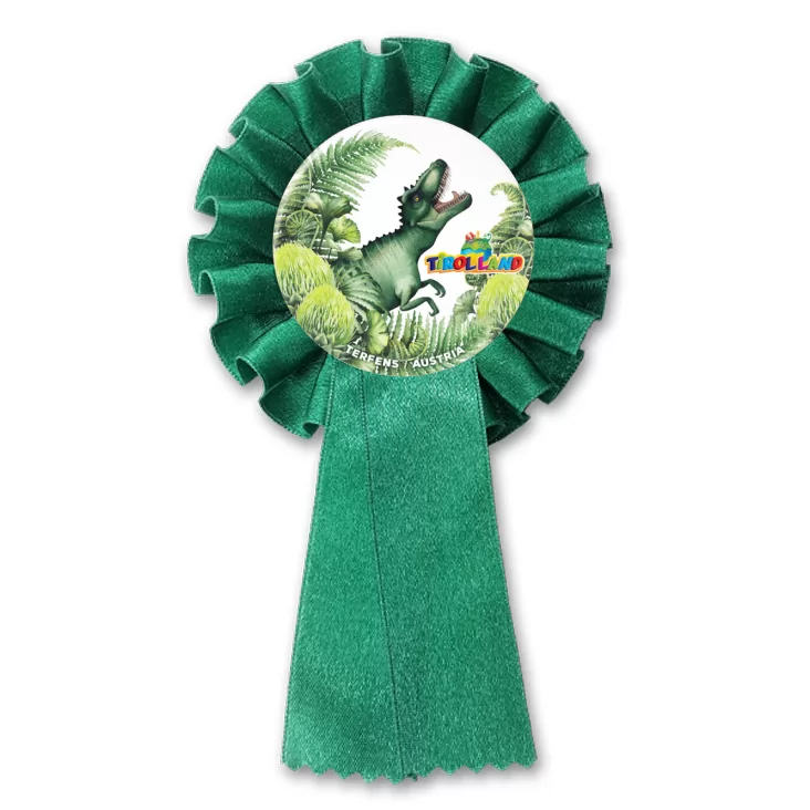 przypinka kotylion Tyranozaur wśród roślin Tirolland