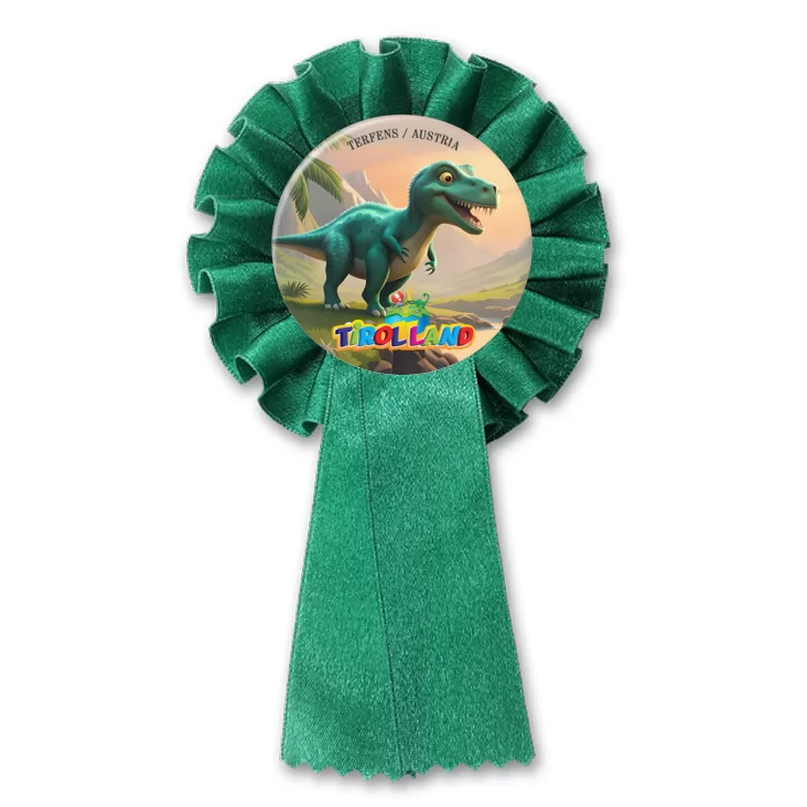 przypinka kotylion Zielony tyranozaur na tle gór Tirolland