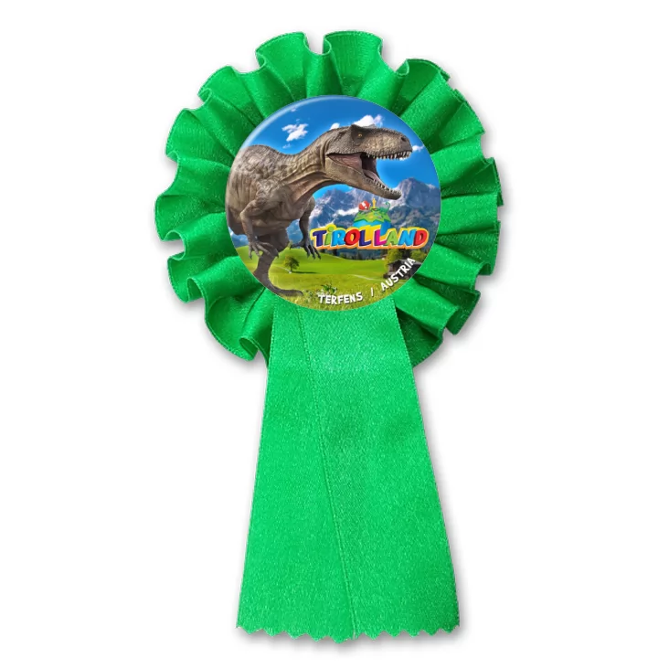 przypinka kotylion Tirolland Tyranozaur na tle gór