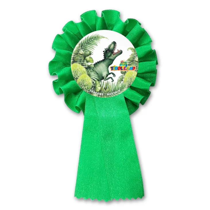przypinka kotylion Tyranozaur wśród roślin Tirolland