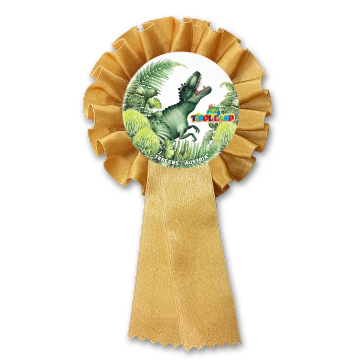 przypinka kotylion Tyranozaur wśród roślin Tirolland