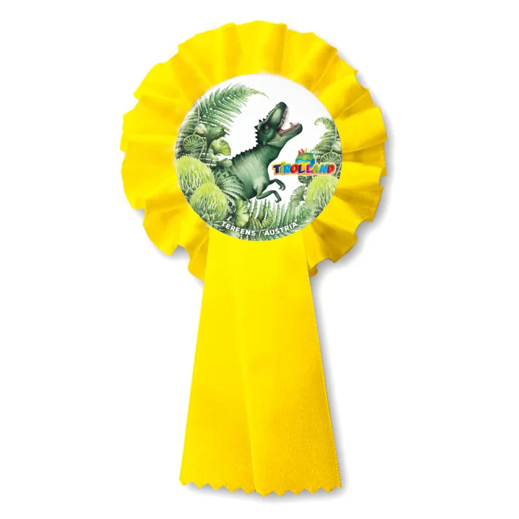przypinka kotylion Tyranozaur wśród roślin Tirolland