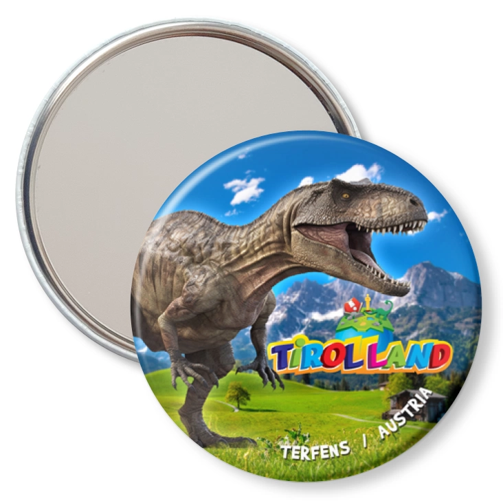przypinka lusterko Tirolland Tyranozaur na tle gór