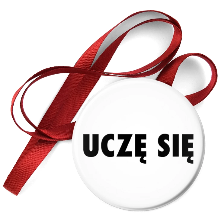 przypinka medal Uczę się białe tło